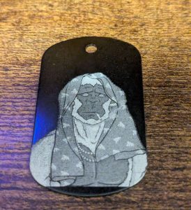Custom dog tag featuring a laser-engraved picture